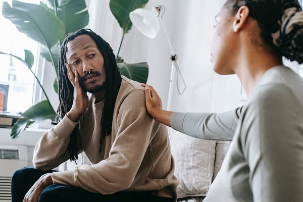 empath man being reassured by a woman