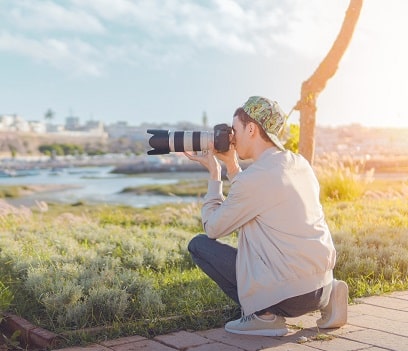 Man taking photo using Dslr Camera