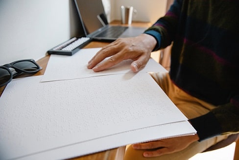 person reading braille