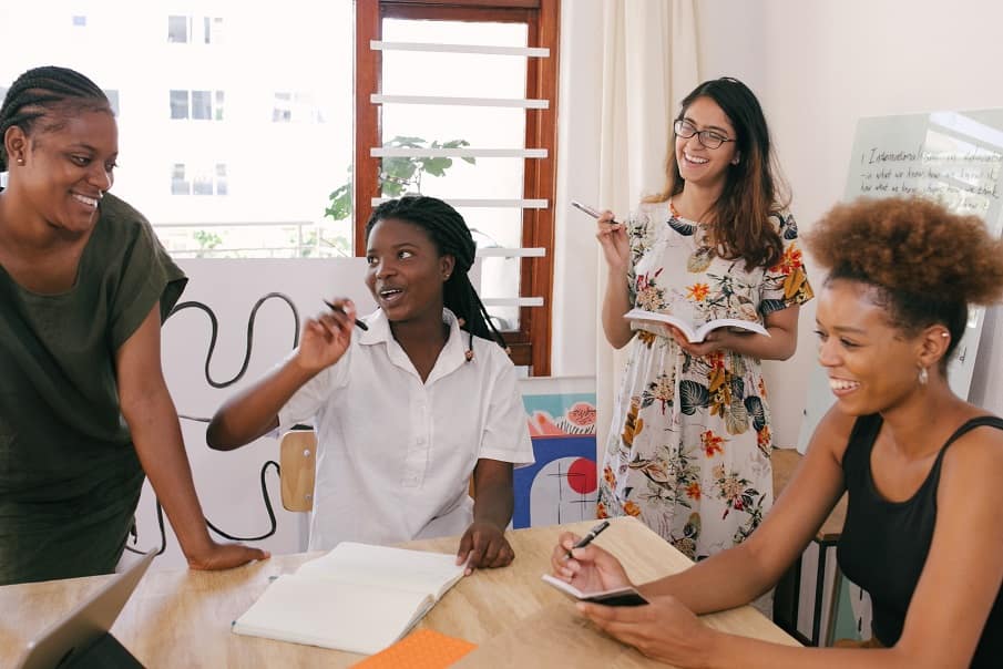 A group of four women having a brainstorming