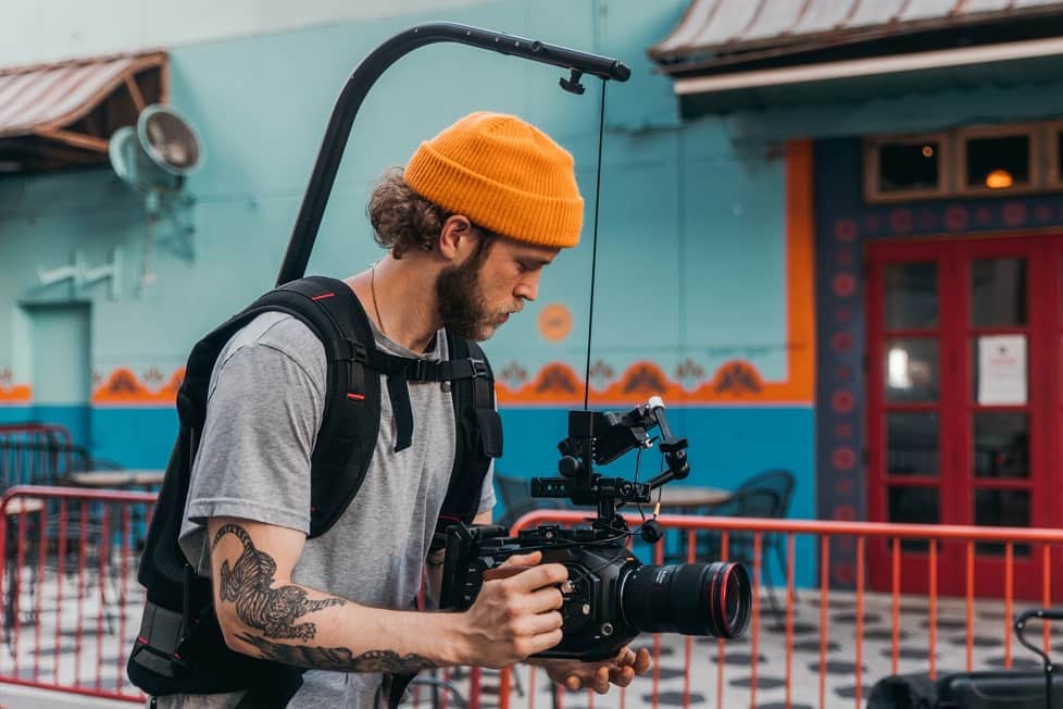 A journalist is recording with his camera